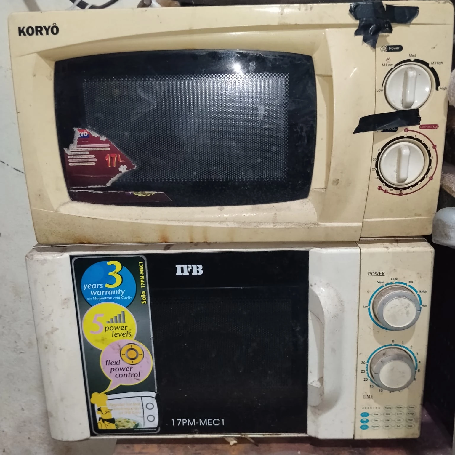 Used Koryo and IFB Microwave Ovens Stack